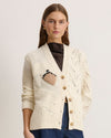 Cream Arthur Cardigan with button closure and acorn design on a model