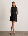 Black Tallulah Dress on a model, sleeveless with a knee-length hemline